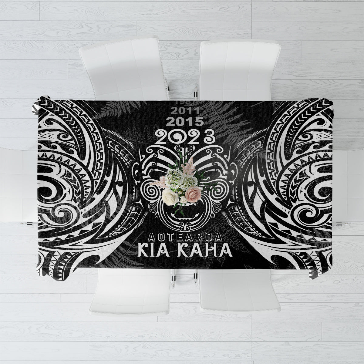 Black tablecloth with white tribal patterns and '2023' text center
