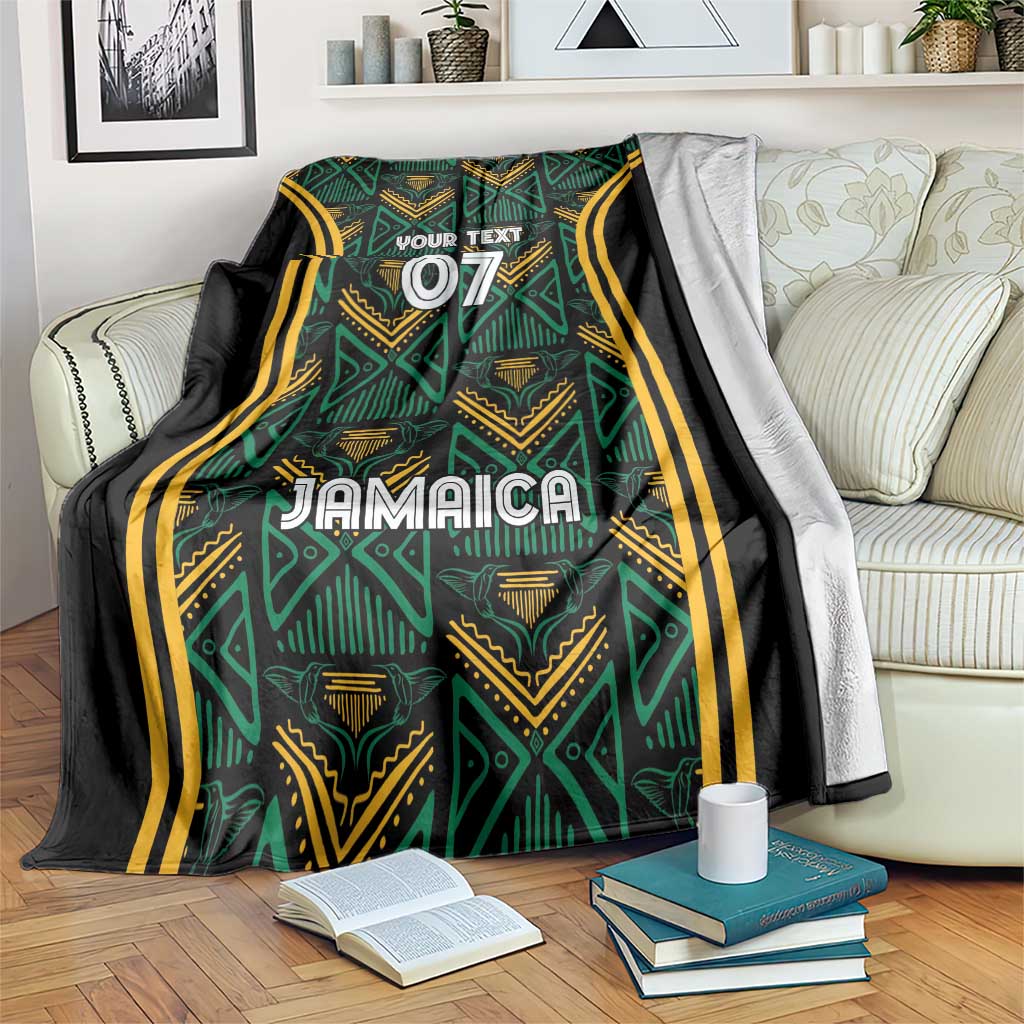 Custom Jamaica reggae blanket with teal and gold tribal pattern, black edges