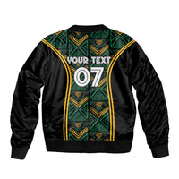 Black bomber jacket with green and gold ethnic motif, back print YOUR TEXT 07, ribbed hem