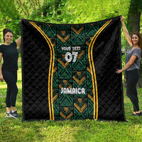 Black quilt with green geometric motifs, gold striped frame, “Your Text” 07, Jamaica