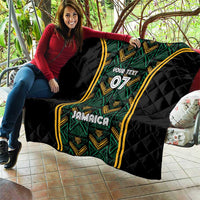 Black quilt draped on sofa with green patterned center and gold borders, “Your Text” 07, Jamaica