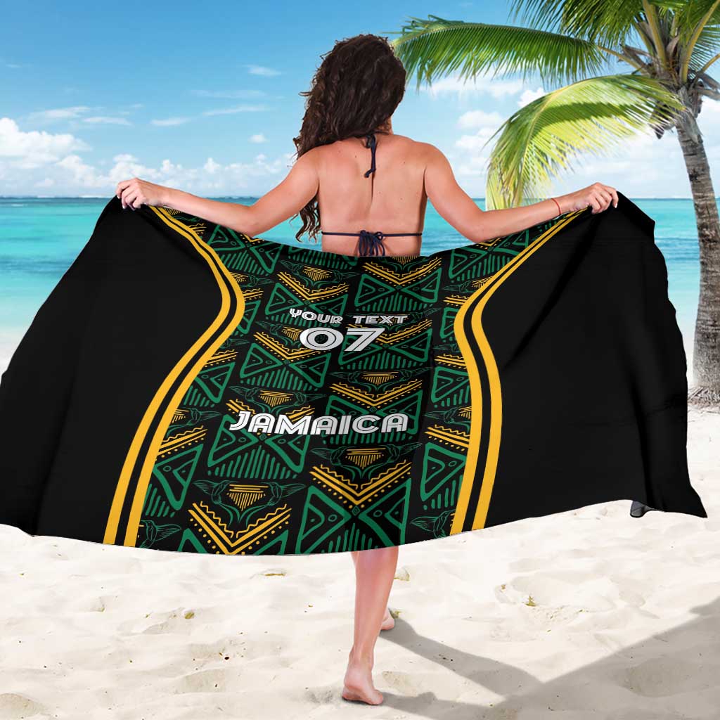 Black sarong wrap with green-gold patterned center and yellow side stripe