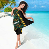 Black sarong cover-up with green-gold motifs and wide yellow stripe
