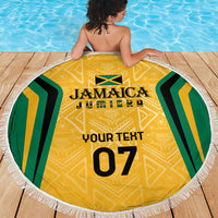 Yellow round beach blanket with Jamaica emblem, gold patterns, and white fringed edge