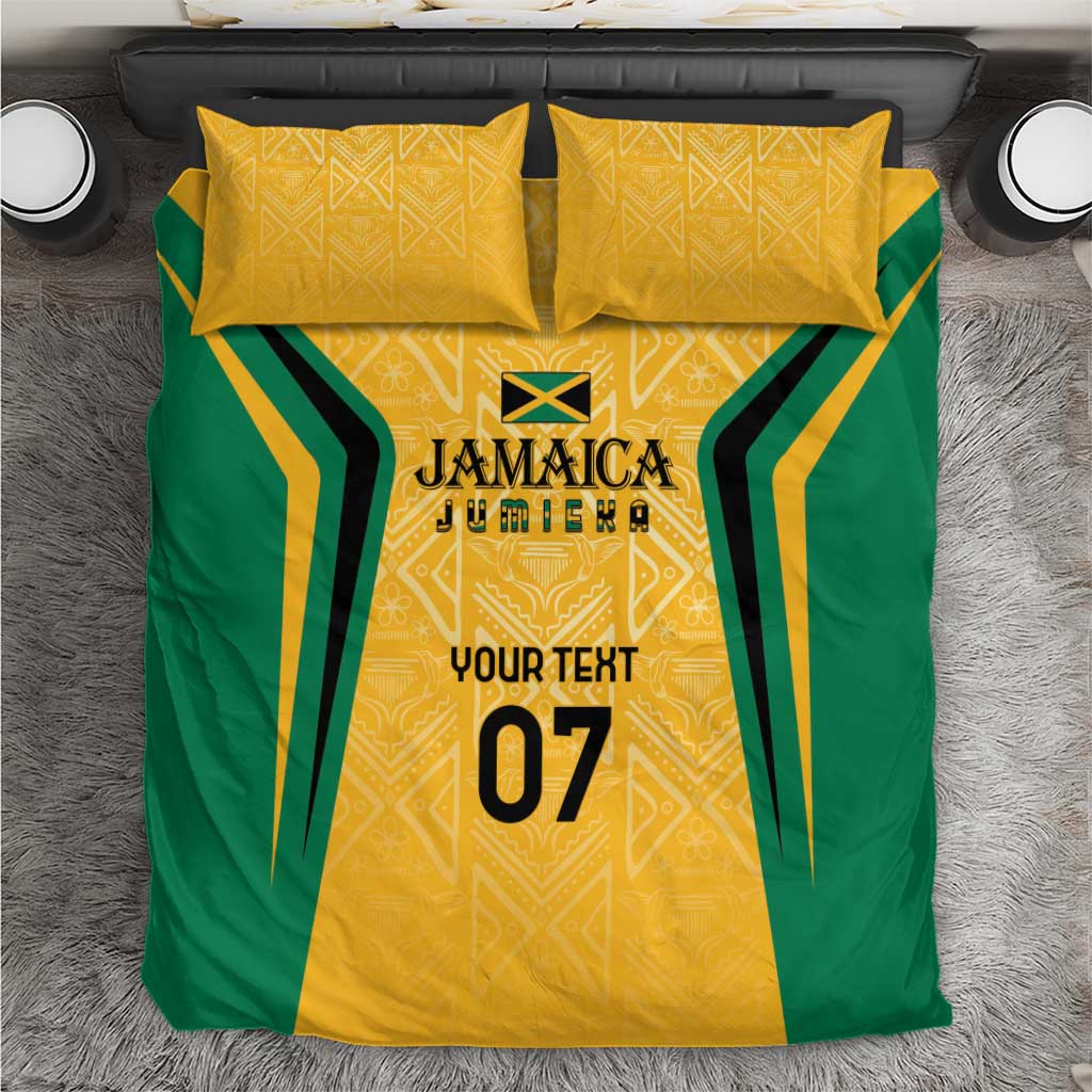 Yellow and green Jamaica bedding set with gold geometric motif and custom text print, on bed