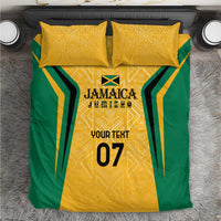 Yellow and green Jamaica bedding set with gold geometric motif and custom text print, on bed