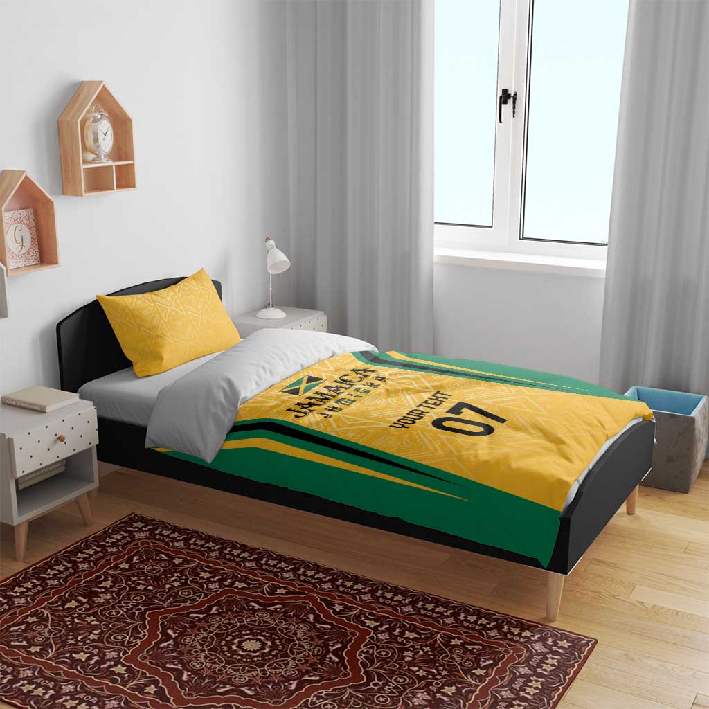 Yellow and green Jamaica bedding set with gold accents and geometric pattern on a single bed