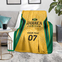 Yellow and green ethnic blanket with custom text and number 07, on gray couch