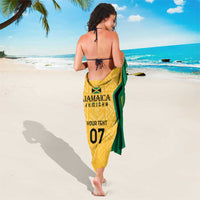Yellow and green sarong with central graphic print and bold diagonal stripe border