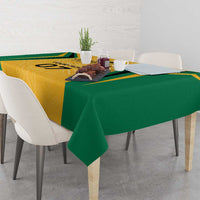 Jamaica tablecloth with yellow center and green overhang, showing geometric motif design