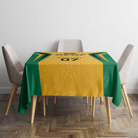 Jamaica tablecloth with yellow center and green edges, centered on dining table