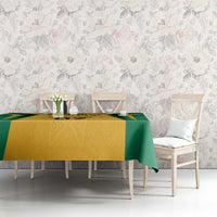 Jamaica tablecloth in yellow and green with ethnic motif, laid across dining table