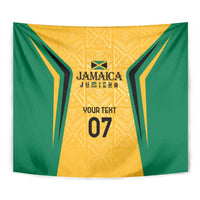 Wall tapestry close-up: green sides, yellow/gold patterned center, Jamaica emblem and '07'