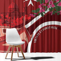 Red curtain panel with Malta skyline artwork and large white emblem band.