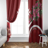 Red curtain pair framing a window; floral pink panel on one side and emblem band.