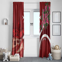 Red window curtains with skyline print on left and pink bougainvillea print on right.