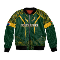 Green bomber jacket with kente patterned sleeves, zipper front, South Africa graphic