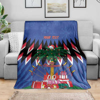 Blue Christmas blanket on sofa with palm tree, presents, and "YOUR TEXT" above