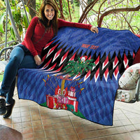 Blue quilt draped on couch with zigzag stripes, palm tree, and Christmas gift illustrations
