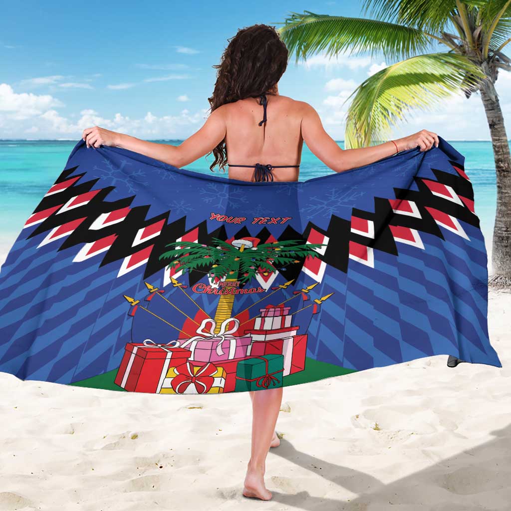 Blue Christmas sarong draped around woman, zigzag bands with gift and palm tree art
