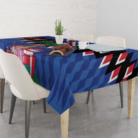 Blue Christmas tablecloth draped on dining table with gift boxes and chevron stripes