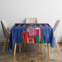 Blue Christmas tablecloth with gift boxes and chevron print on square dining table