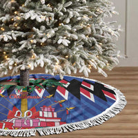 Blue round tree skirt with black-and-white zigzag, wreath-and-gift graphic, white fringe