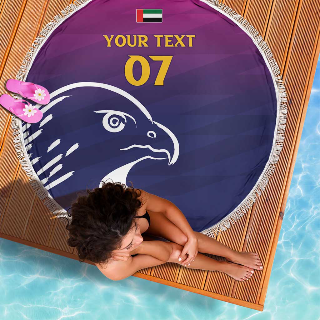 Round beach blanket with purple/navy falcon, white fringe edge, custom text 07 and UAE flag