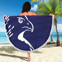 Round beach blanket with large navy falcon graphic and white fringe border