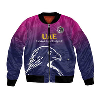 Unisex cricket bomber jacket, blue with purple satin sheen and front zip with UAE emblem