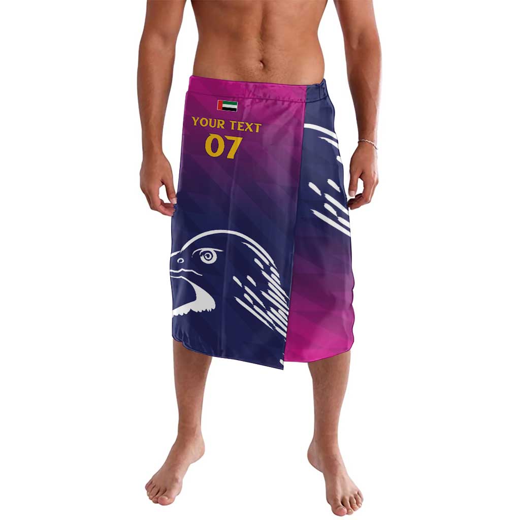 Cricket lavalava shorts, blue and magenta with falcon print and 'Your Text 07'.