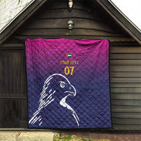 Custom quilt blanket hanging on wall, quilted pattern with Arabian falcon and yellow text
