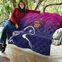 Custom quilt blanket held outdoors, quilted design with Arabian falcon and yellow "07"
