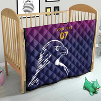 Custom quilt blanket in crib, quilted Arabian falcon graphic with yellow "07" text