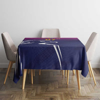 Custom tablecloth centered on a table with Arabian falcon graphic in dark blue and purple.