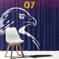 Blue and purple curtain close-up with large white falcon head and yellow “07”