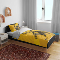 Yellow hockey bedding set on bed with matching duvet and pillows featuring player graphic