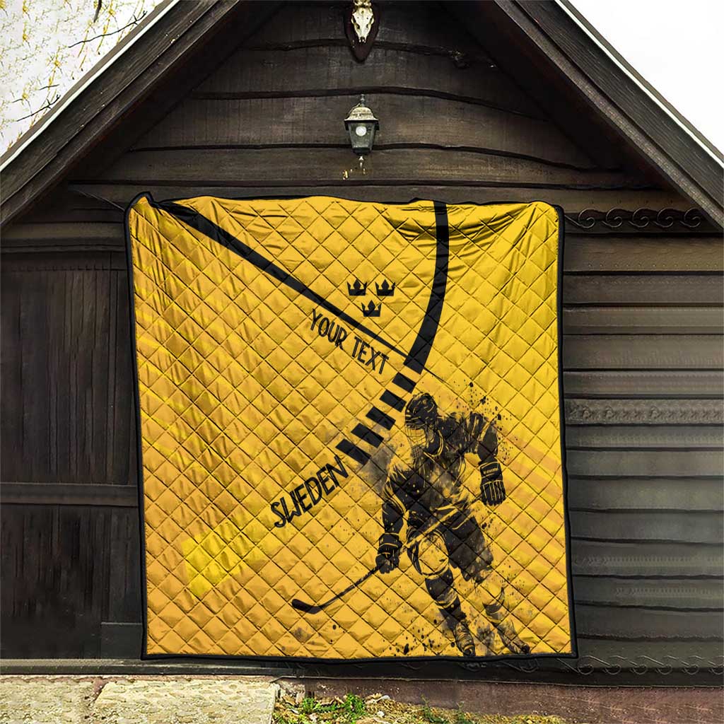 Yellow quilt hanging on wall with black border; crown, “YOUR TEXT,” goalie graphic and “SWEDEN”