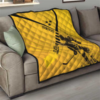 Yellow quilt draped on sofa; black trim and stripe with crown, “YOUR TEXT,” goalie graphic