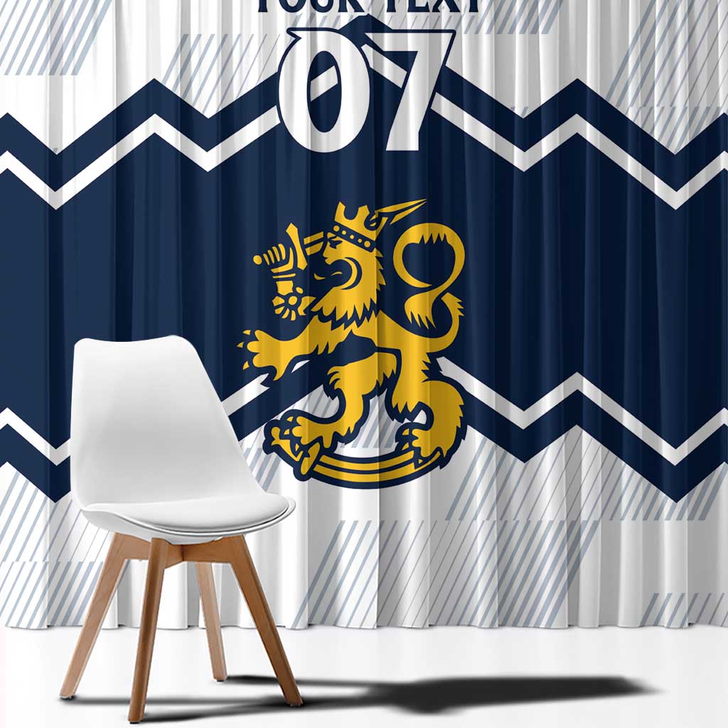 Navy and white window curtains with zigzag chevrons and yellow lion crest, shown behind chair.