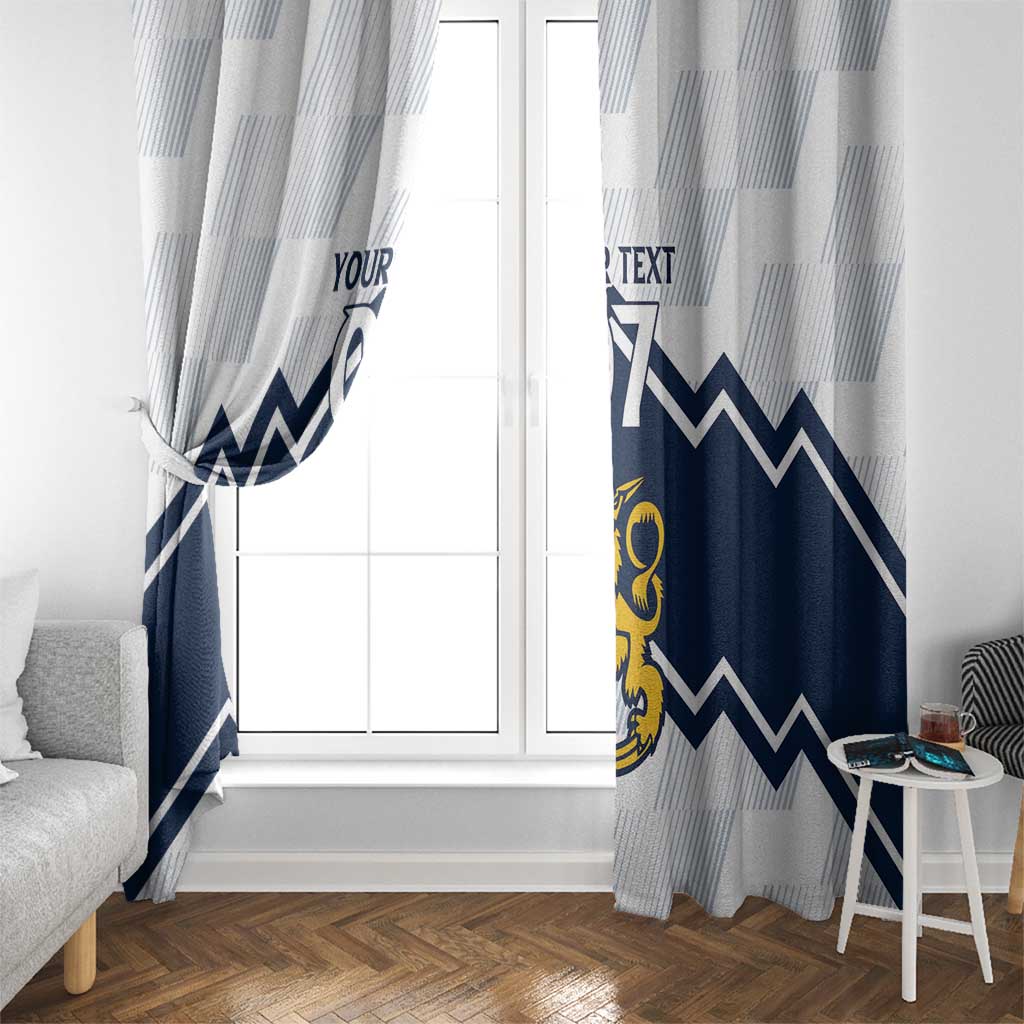 Hanging window curtains in white and light-blue stripes with navy chevrons and yellow crest.