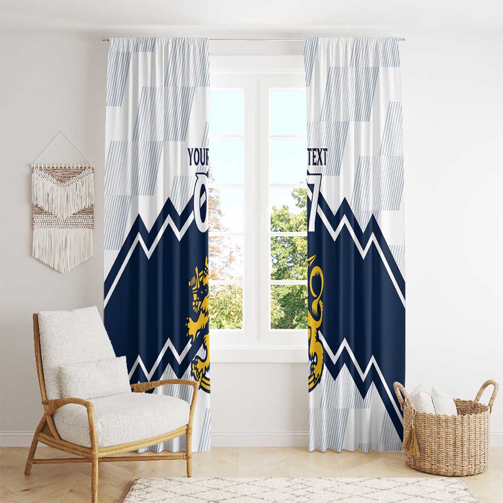 Window curtains with white and light-blue stripe fabric, navy chevron bands, yellow crest details.