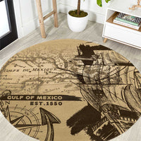 Round vintage map rug in tan with black Gulf of Mexico text and ship illustration