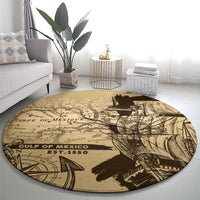 Round tan vintage map rug showing black “Gulf of Mexico” lettering and “Est. 1550”