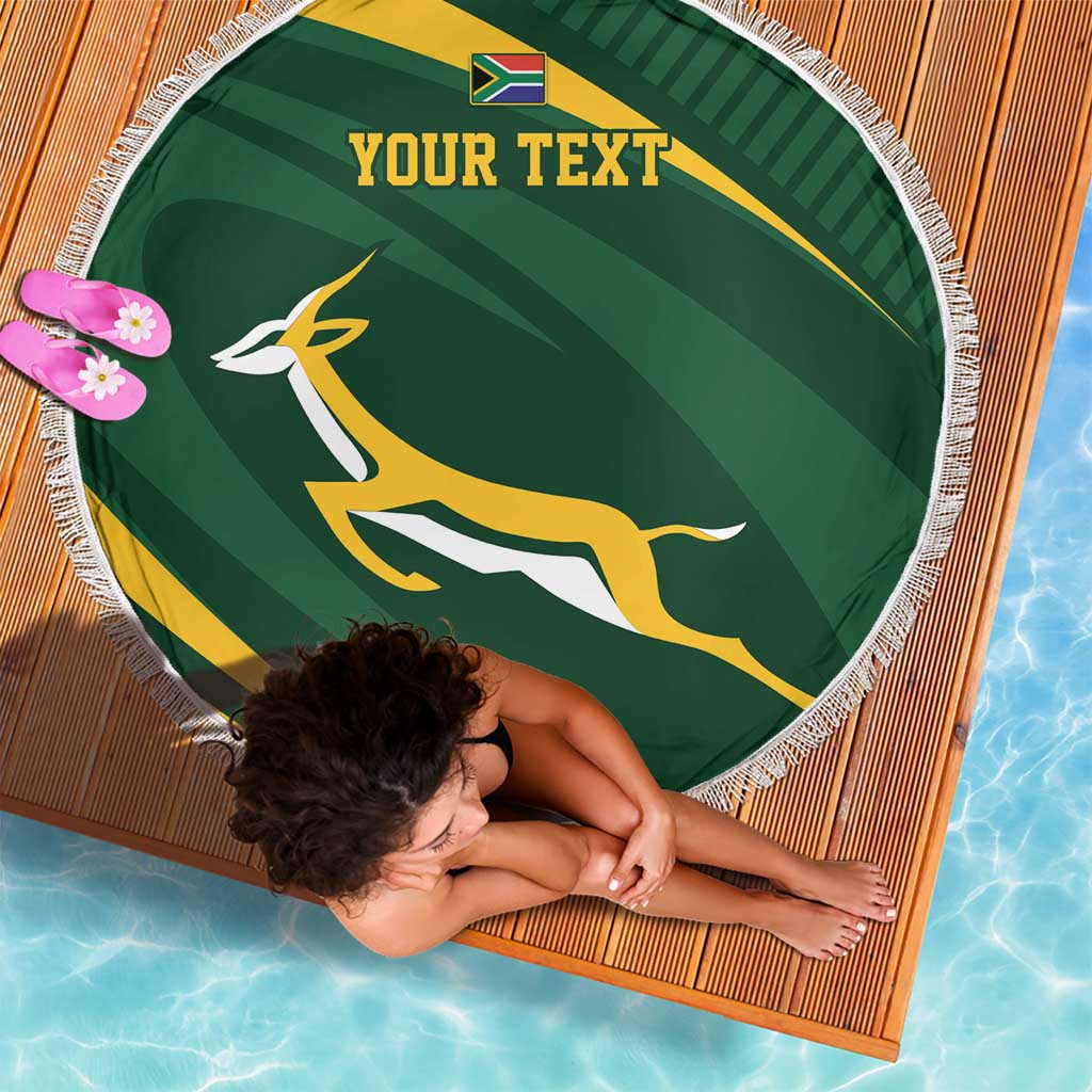 Round green personalized rugby beach blanket with fringe, emblem, and “YOUR TEXT”
