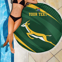 Round green personalized rugby beach blanket with fringe and “YOUR TEXT” by pool
