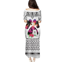 White long off-shoulder puletasi dress with black tribal print and Samoyed dog back graphic