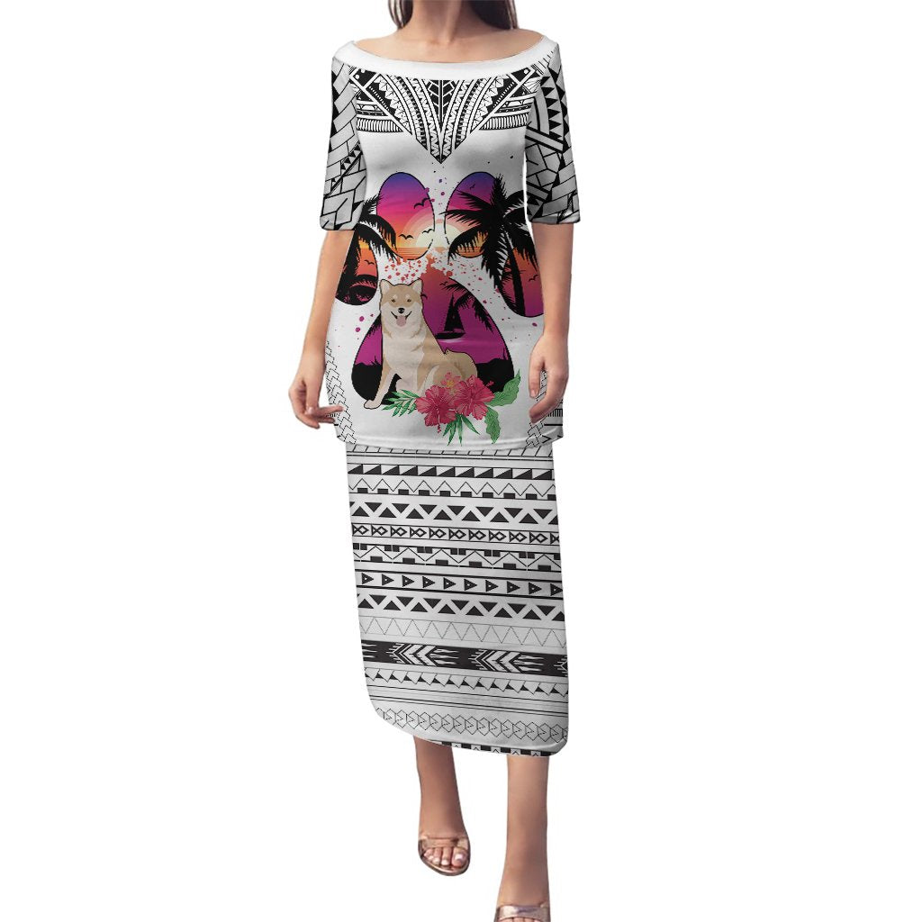 White long off-shoulder dress with black tribal pattern and colorful dog graphic