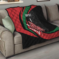 Personalized quilt blanket over sofa, black/red/green graphic with lion shield and text