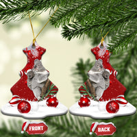 Red ceramic bell-shaped koala Santa ornament hanging on tree with gold loop